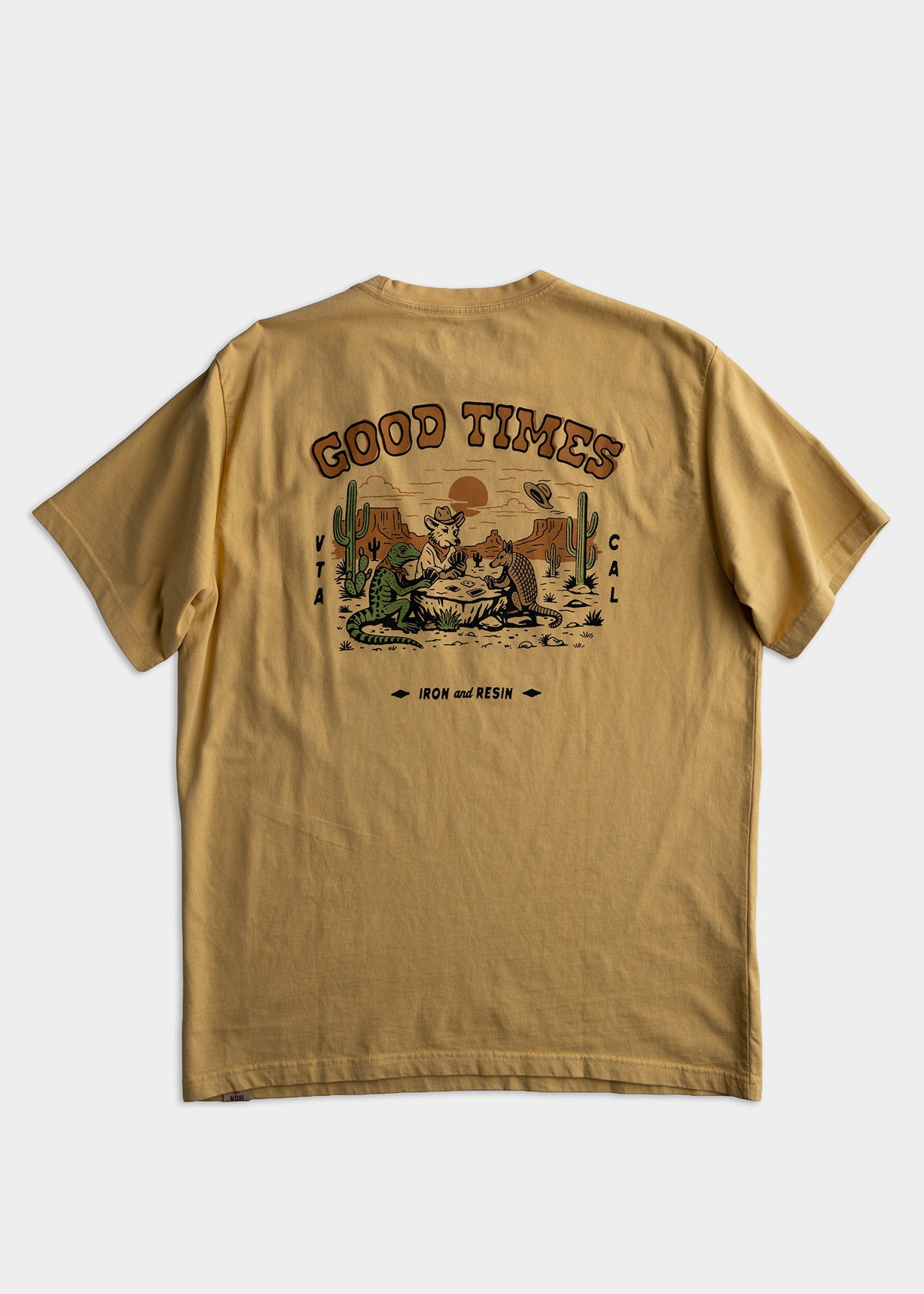 Tan T-shirt with "Good Times" text, desert scene, cacti, and animals. Brand: Iron and Resin. Casual, outdoor style.