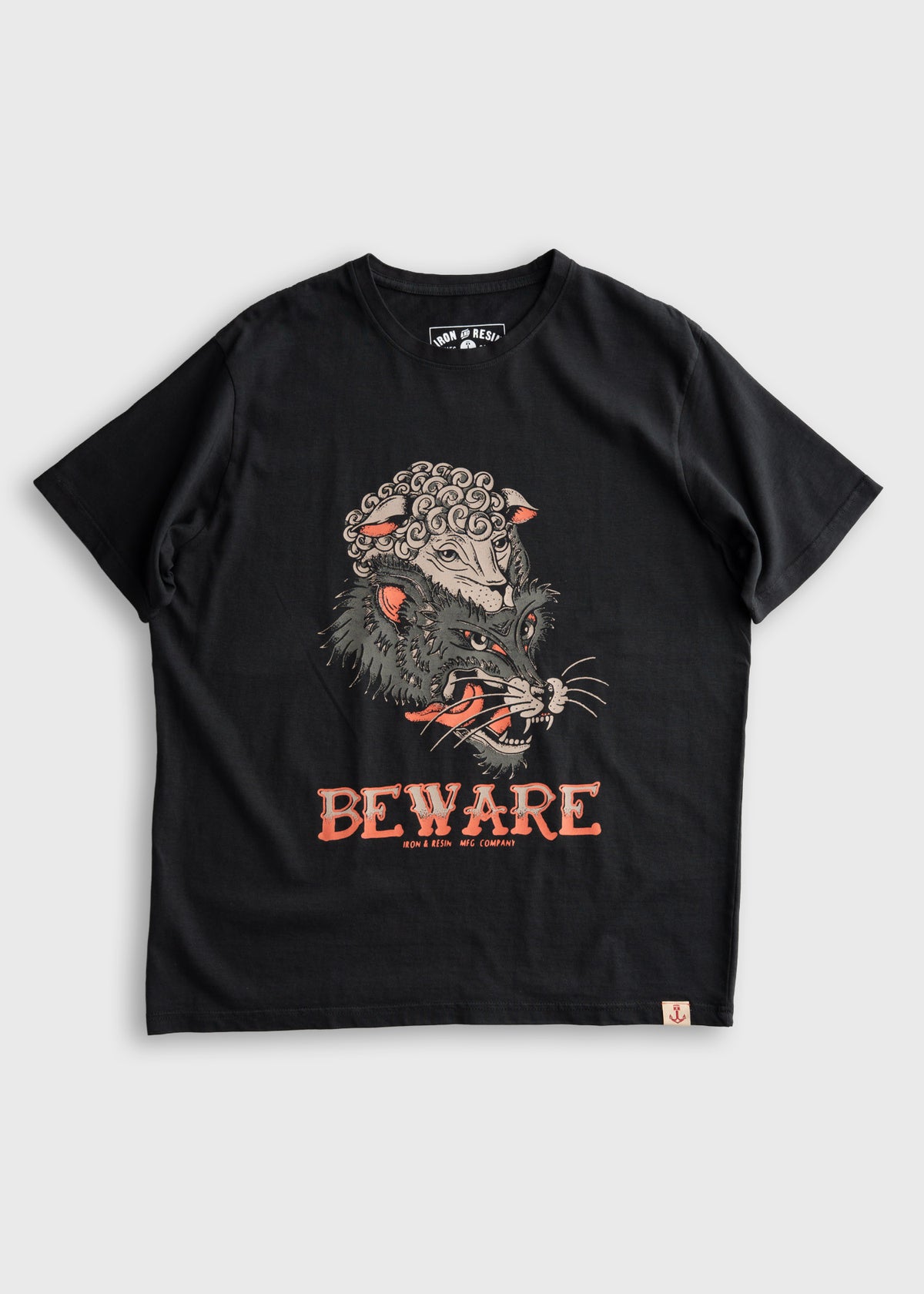 Black T-shirt featuring a fierce wolf in sheep's clothing design with "BEWARE" text. Iron & Resin branding below.