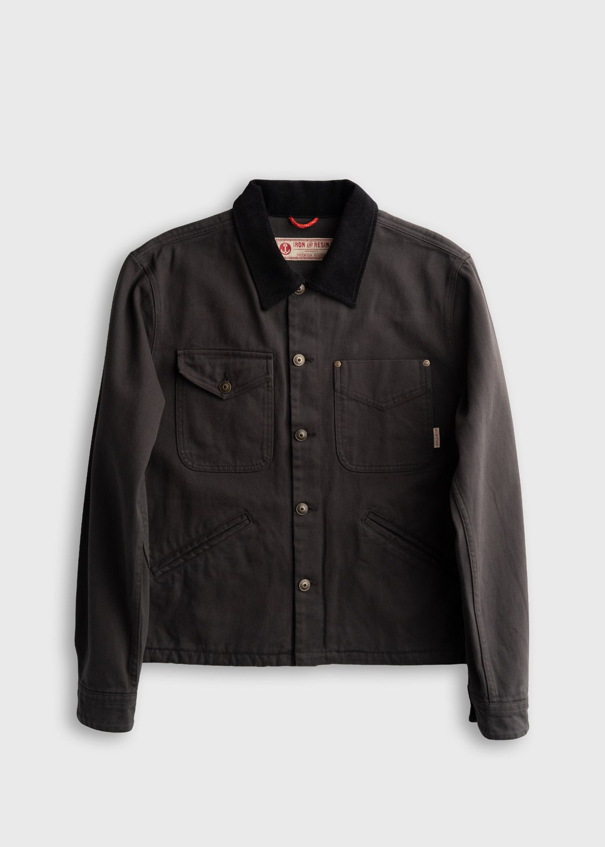Men’s peach bull denim jacket with corduroy collar and boxy fit, four front pockets and shank button closure, durable cotton workwear outerwear with classic utility design
