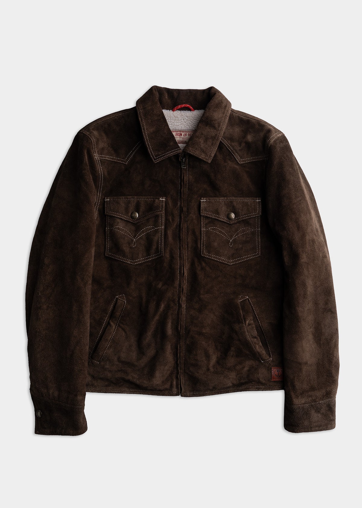 Dark brown suede jacket with front zipper, two chest pockets, and a collar, displayed on a plain white background.