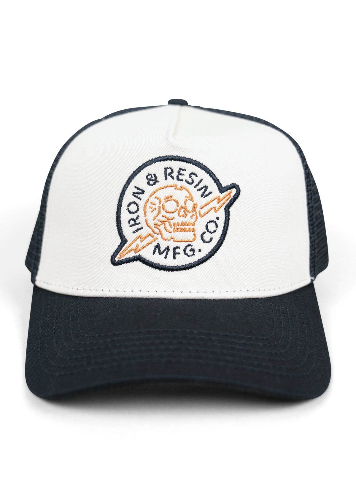 White and black trucker hat with "Iron & Resin MFG Co" logo featuring an orange skull and lightning bolt design.