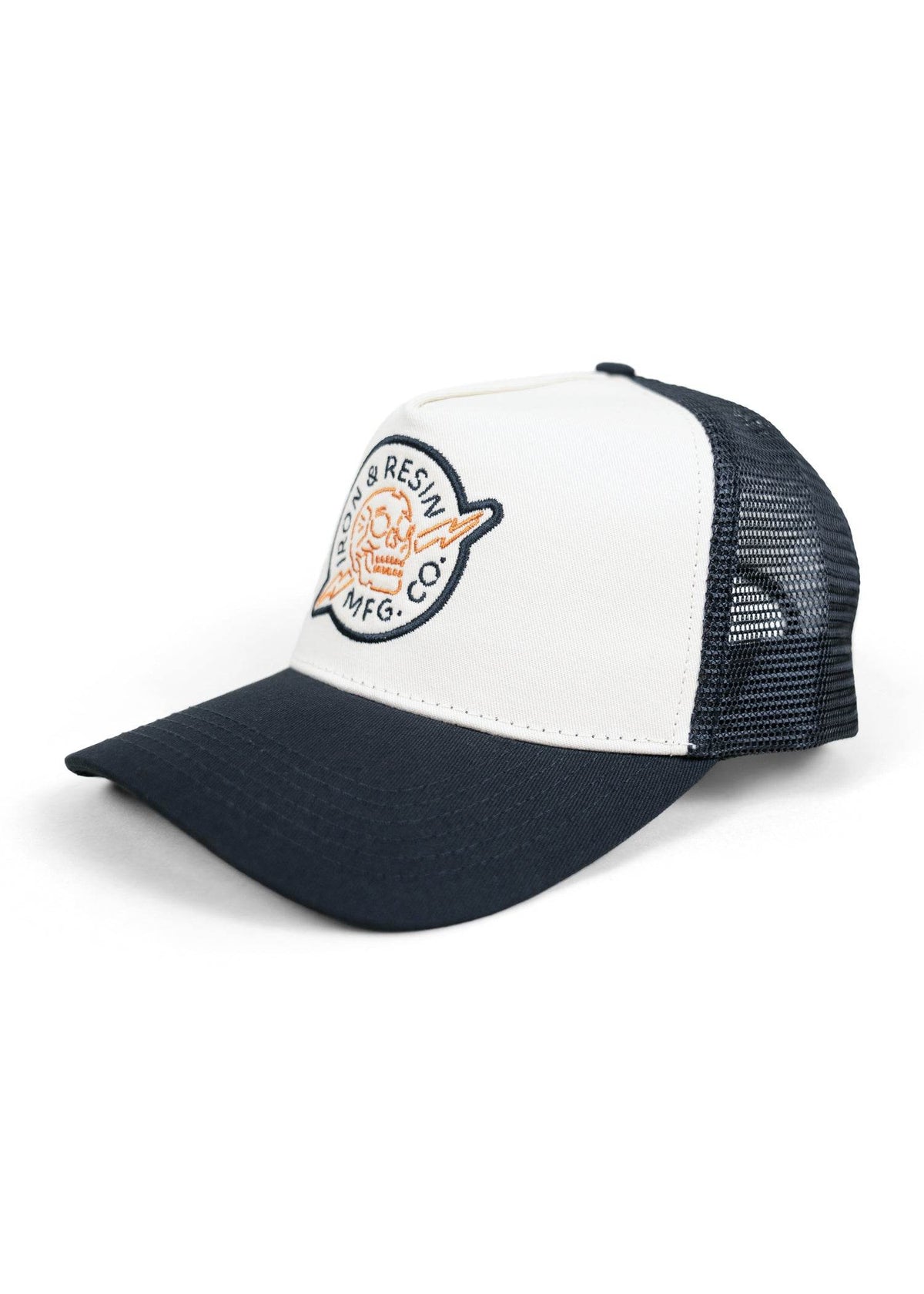 White and black trucker hat with "Iron & Resin MFG Co." logo featuring a skull and lightning bolt on the front panel.