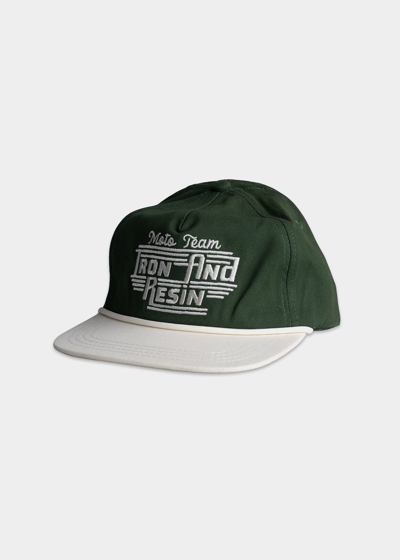 Green cap with "Moto Team Iron and Resin" embroidered in white, featuring a contrasting white brim on a plain background.
