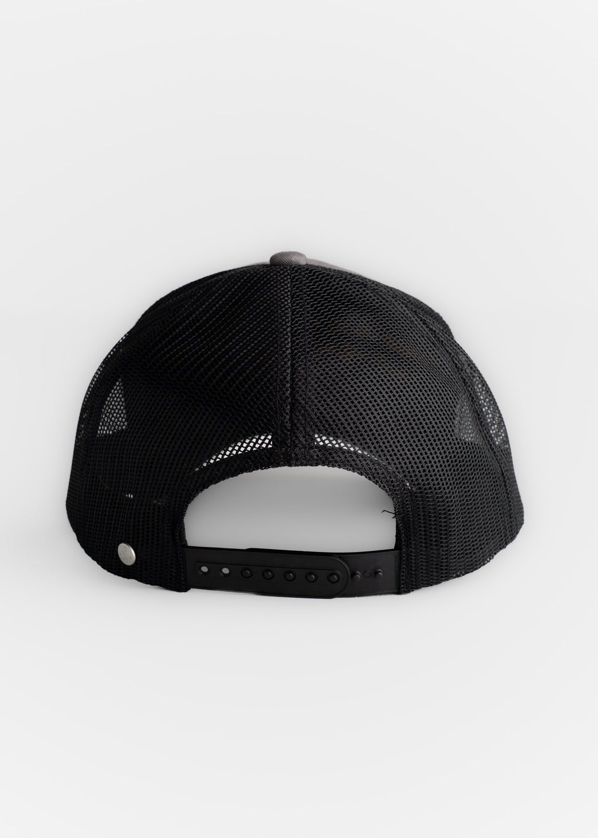 Black mesh trucker cap with adjustable snapback closure, viewed from the back on a plain white background.