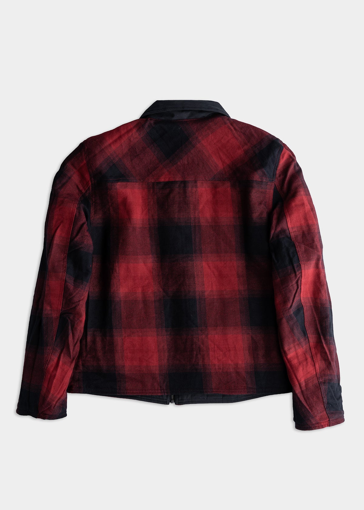 Red and black plaid jacket shown from the back on a white background, highlighting its pattern and long sleeves.