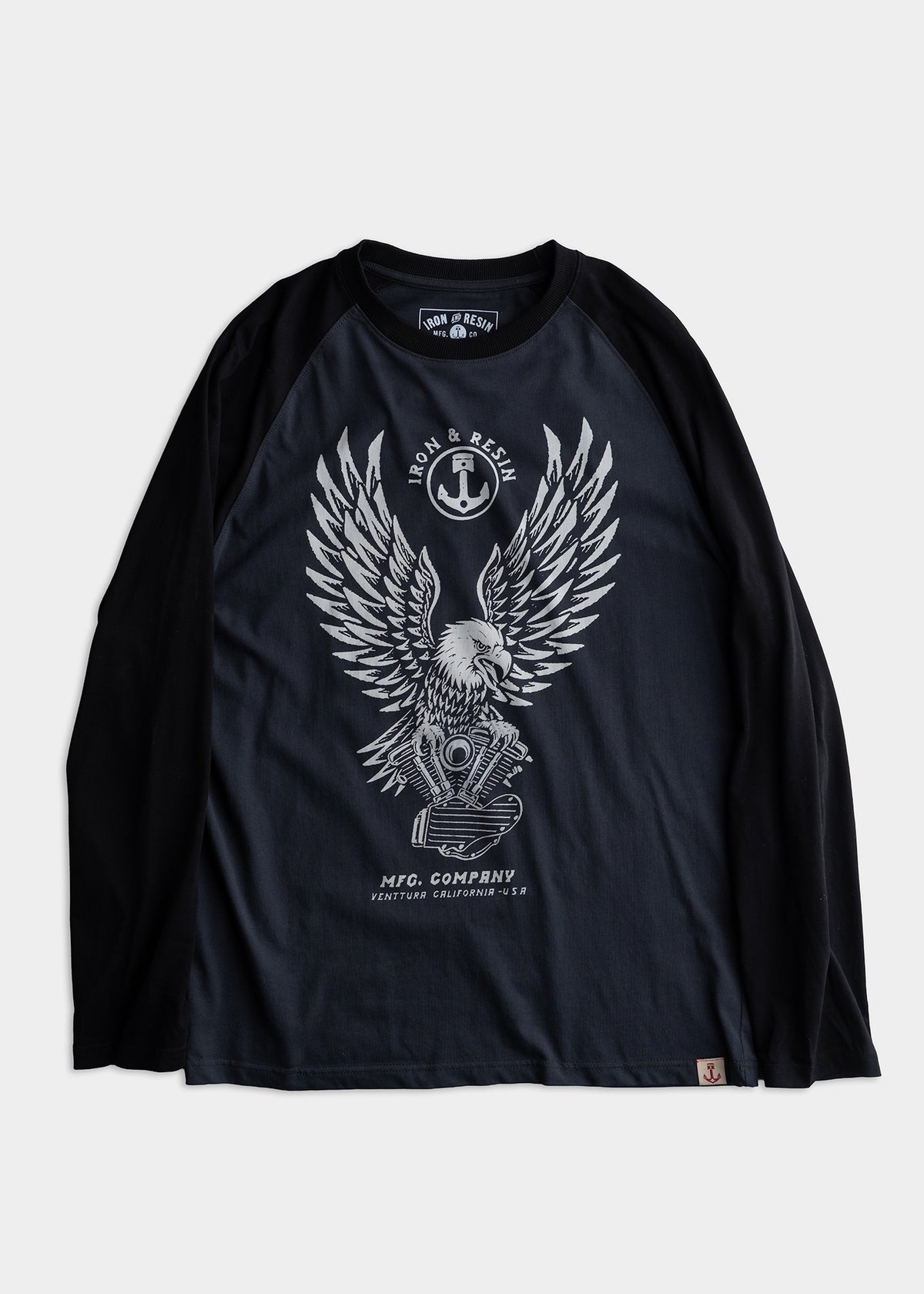Black long-sleeve shirt with eagle and engine graphic, "Iron & Resin" logo, and "MFG Company Ventura California USA" text.