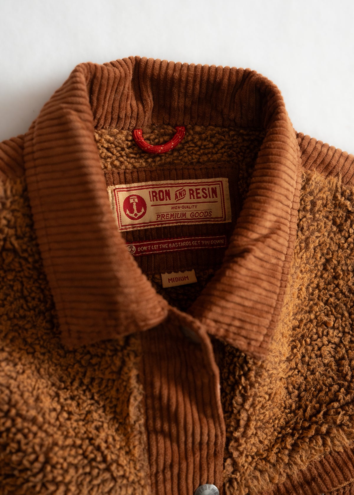 Brown corduroy and sherpa jacket with "Iron and Resin" label, showcasing premium quality and medium size on a white background.