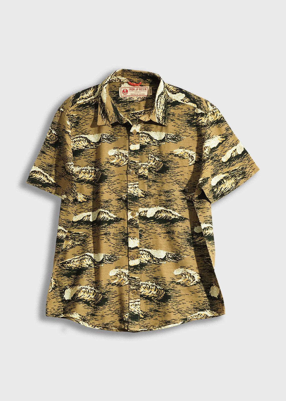Short-sleeve shirt with a wave pattern in brown and black tones, featuring a collar and buttons, on a plain background.