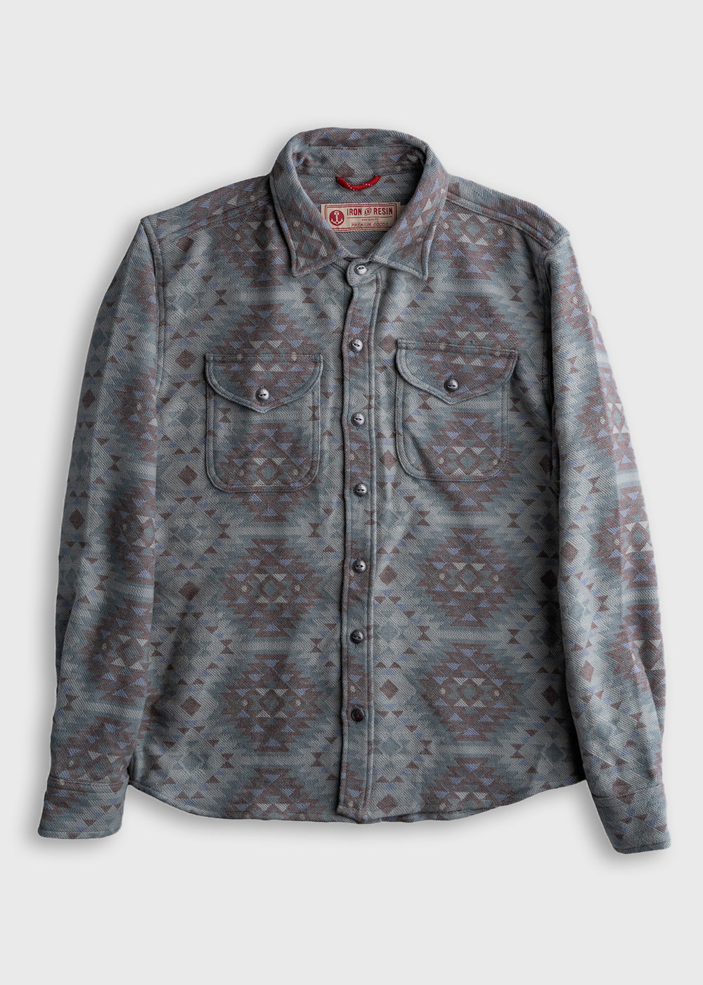 Gray patterned shirt with geometric design, buttoned front, and two chest pockets, displayed on a plain background.