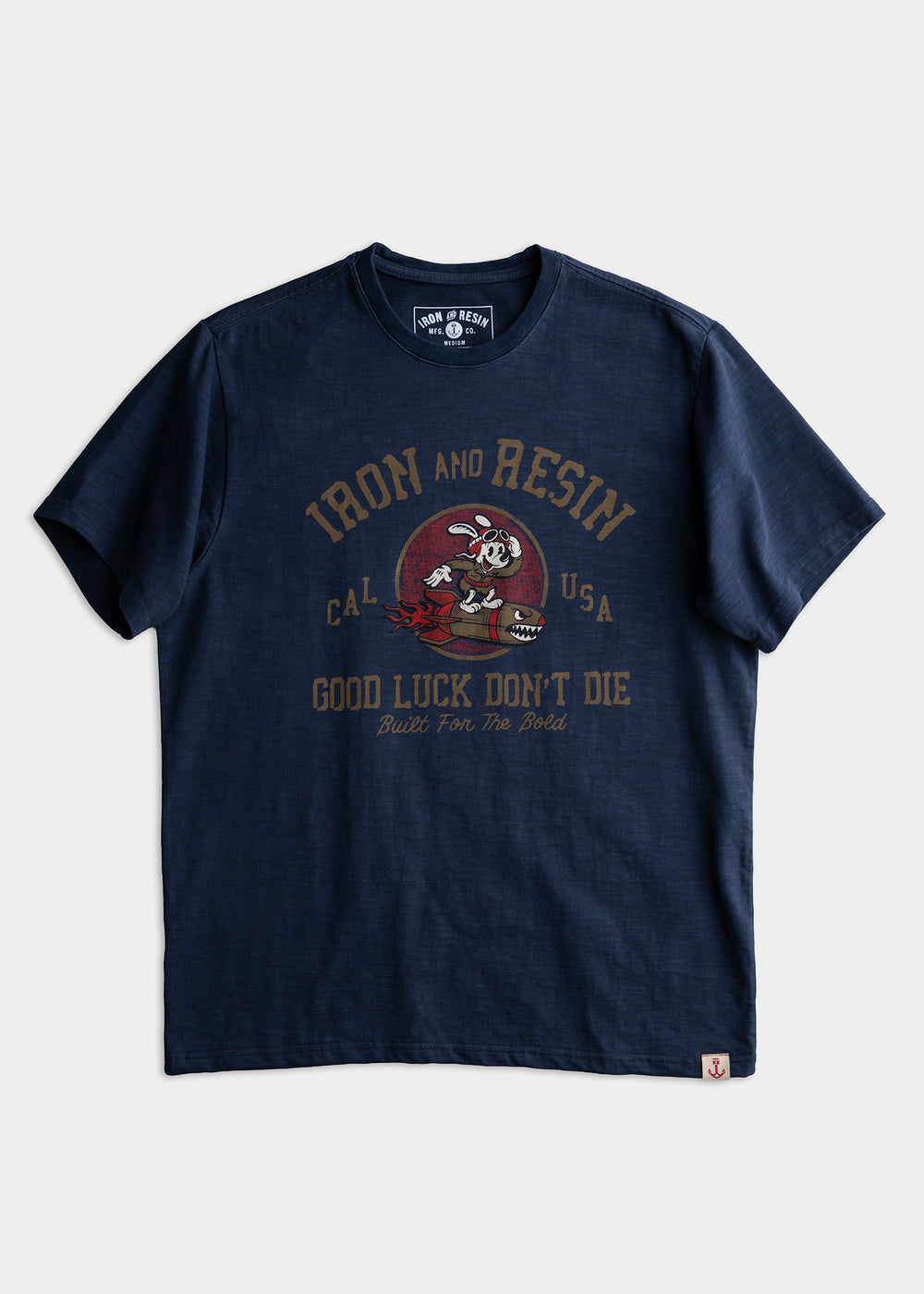 Navy blue T-shirt with "Iron and Resin" logo, cartoon character, and "Good Luck Don't Die" text. Casual and bold design.