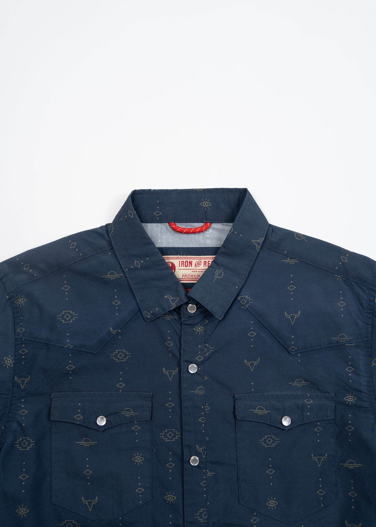 Navy blue western shirt with subtle geometric patterns and silver snap buttons, featuring two chest pockets and a pointed collar.