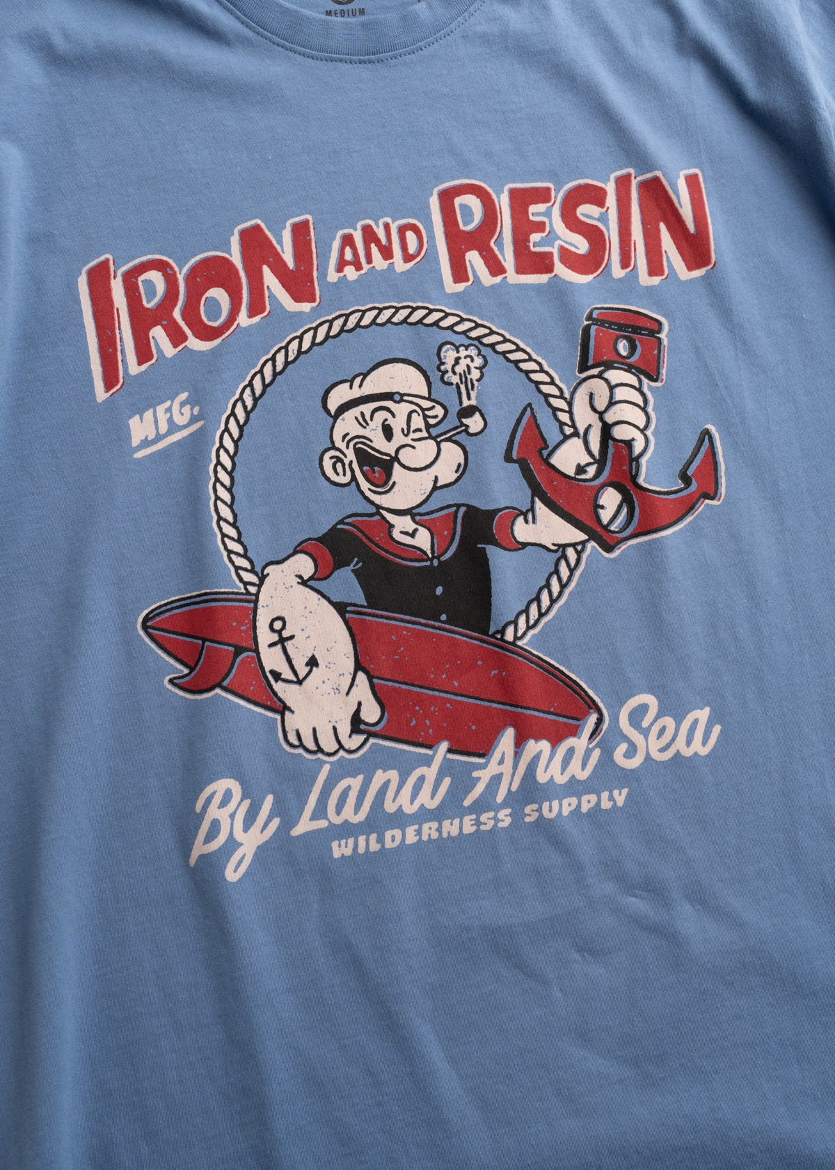 Men’s organic cotton t-shirt in light blue, with custom graphic print and soft feel, lightweight everyday tee