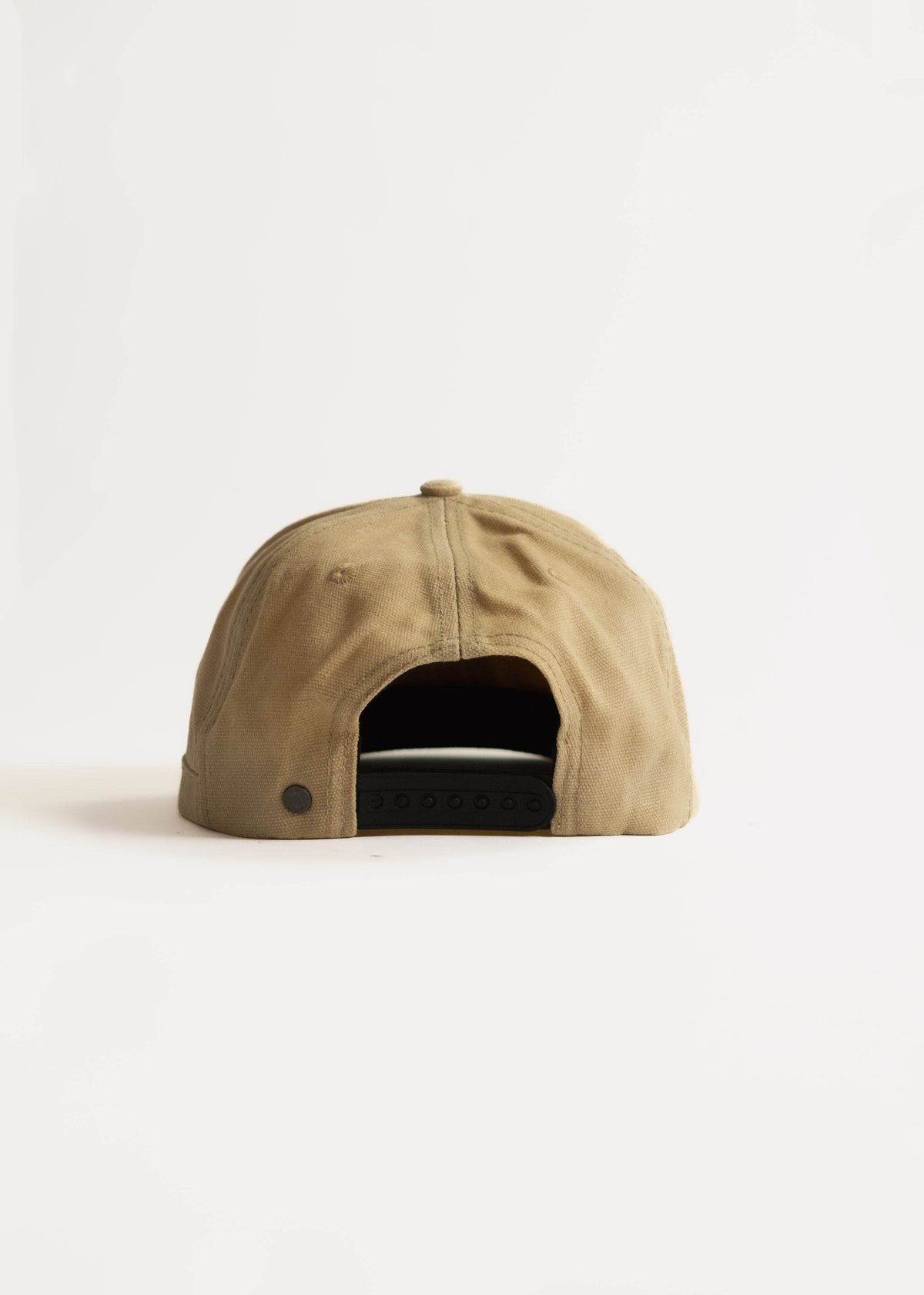 Tan baseball cap with adjustable strap, viewed from the back, on a white background. Simple and casual design.