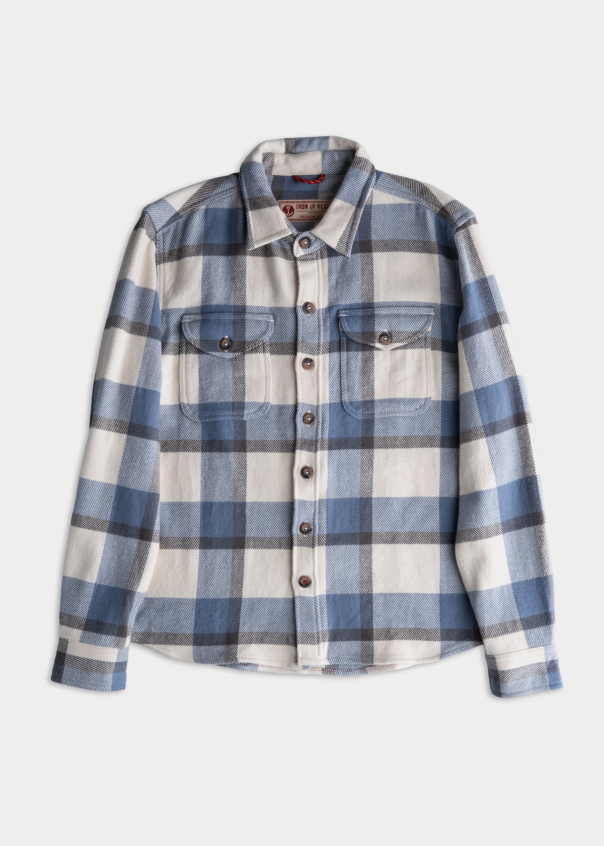Blue and white plaid flannel shirt with button front and two chest pockets, displayed on a white background.