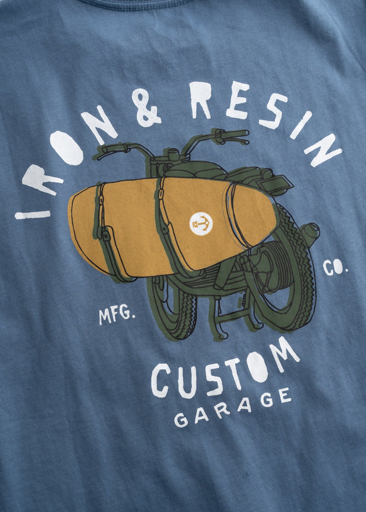 Blue shirt with "Iron & Resin Custom Garage" text and a graphic of a motorcycle with a sidecar.