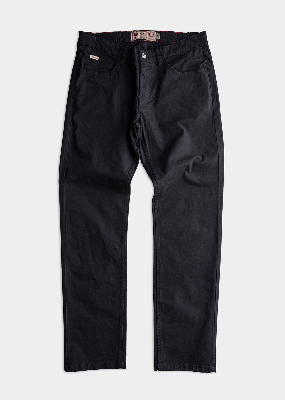 Black denim pants with button closure and front pockets, displayed flat on a white background. Iron & Resin label visible inside.