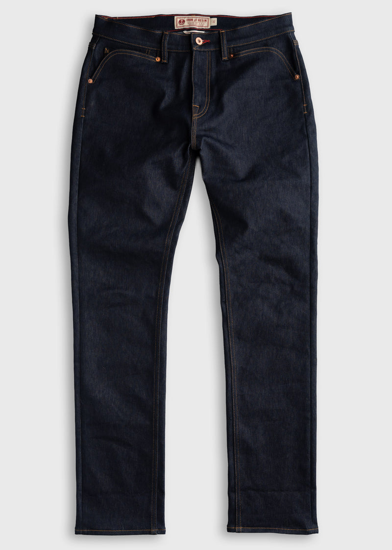 Dark blue denim jeans with orange stitching, button closure, and front pockets, laid flat on a white background.