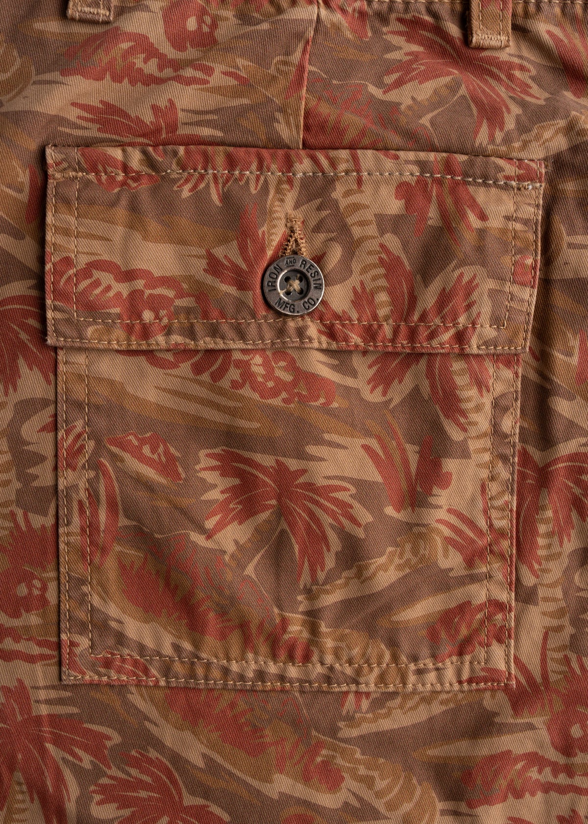 Close up of rear patch pockets on cotton twill pants, showcasing functional storage and construction