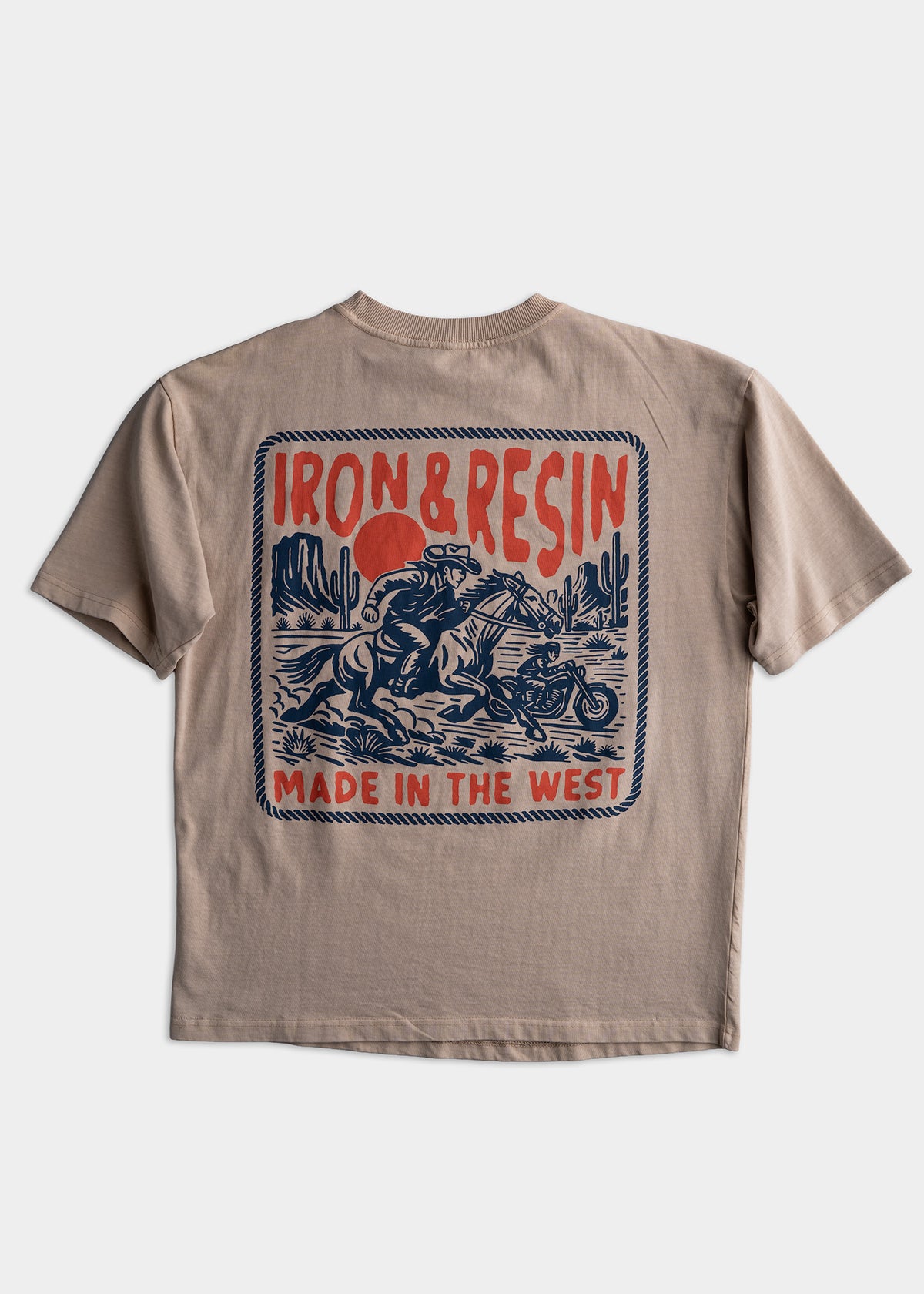 Beige T-shirt with "Iron & Resin" and "Made in the West" text, featuring a cowboy, horse, and motorcycle graphic.