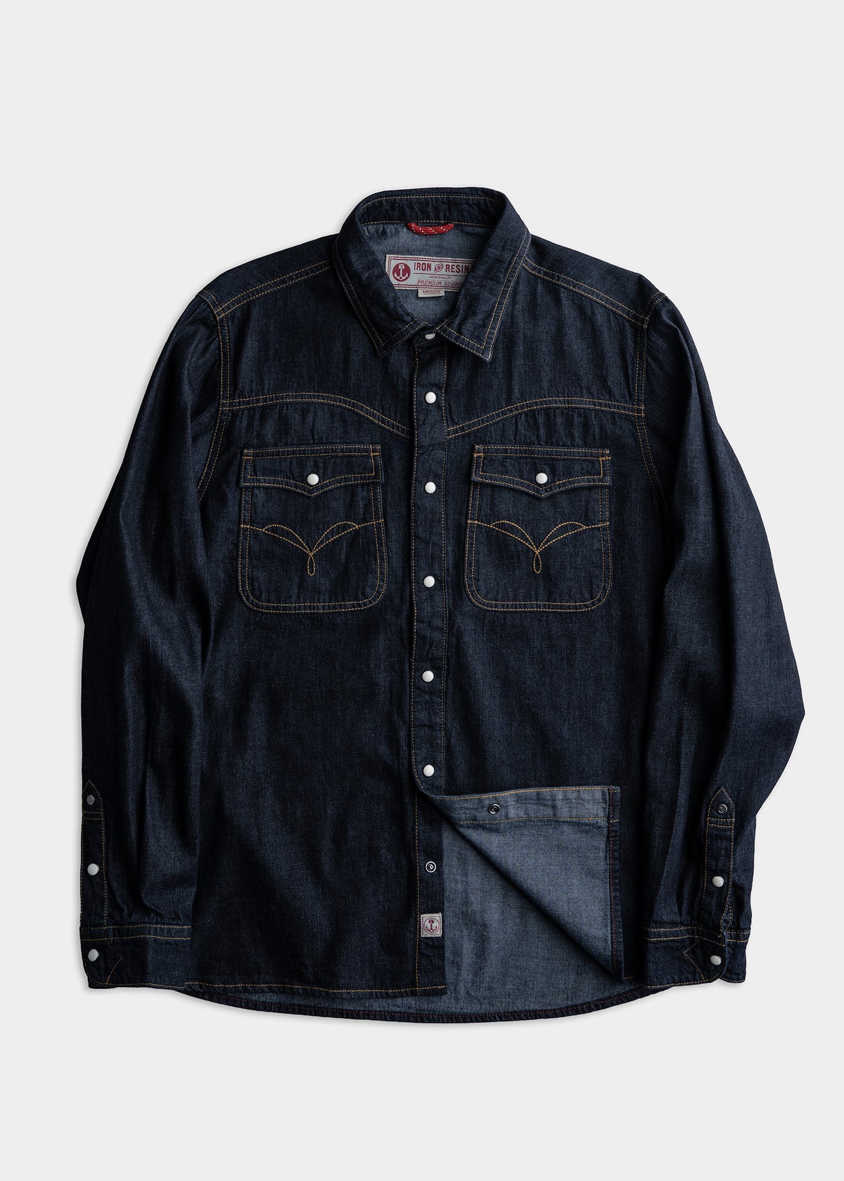 Dark denim shirt with contrast stitching, button closure, and two chest pockets, displayed against a plain white background.