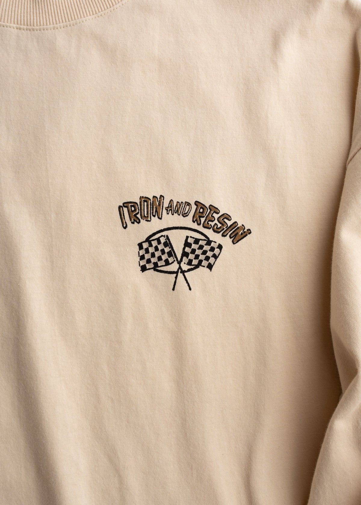 Close up of custom chest graphic print on long sleeve cotton t shirt, highlighting print detail and finish