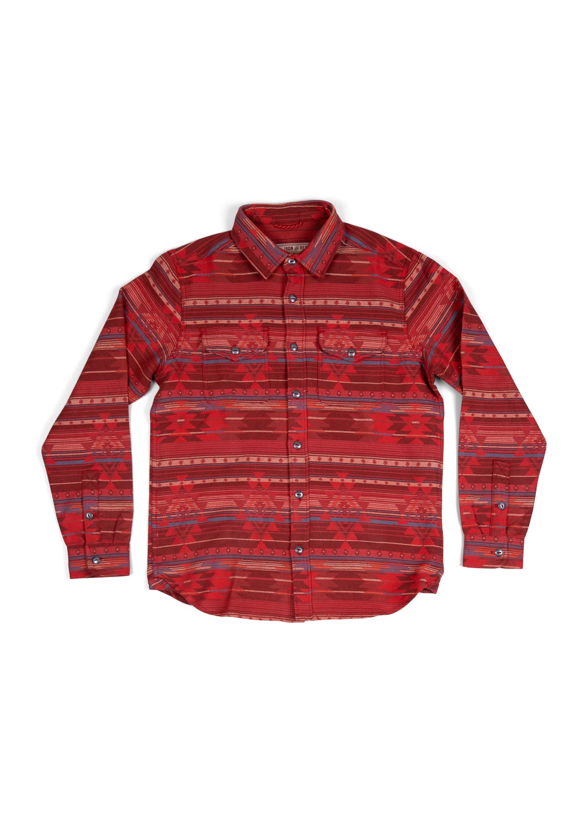 Red patterned button-up shirt with geometric designs, long sleeves, and a collar, laid flat against a white background.