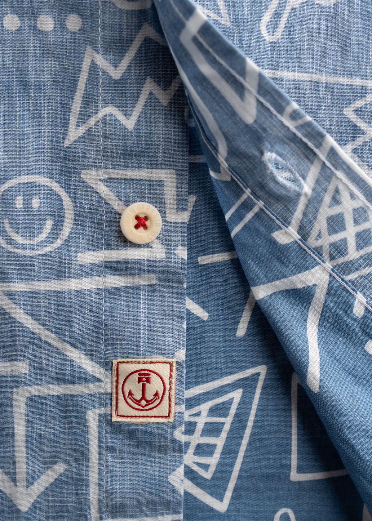 Close up of buttons and label on poplin shirt, highlighting clean construction