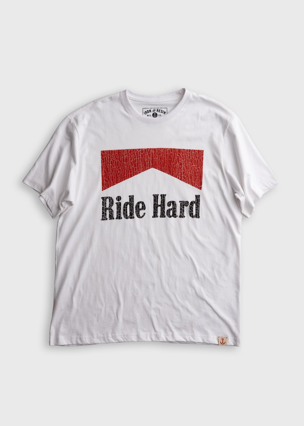 White T-shirt with "Ride Hard" text and red graphic. Simple design, casual style. Perfect for motorcycle enthusiasts.