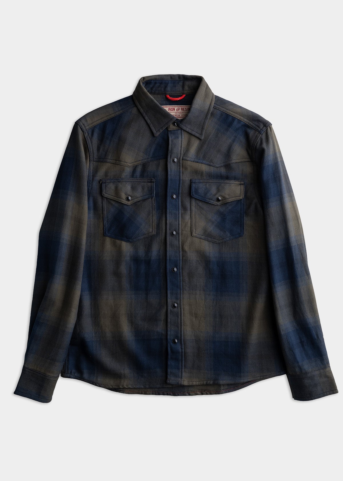Dark plaid button-up shirt with two chest pockets, laid flat on a white background, showcasing its casual style and design.