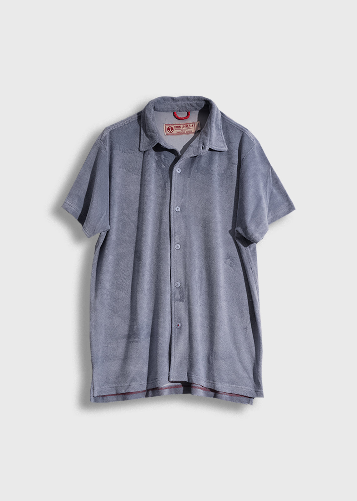 Gray short-sleeve button-up shirt with a collar, displayed on a plain background, featuring a visible inner label.