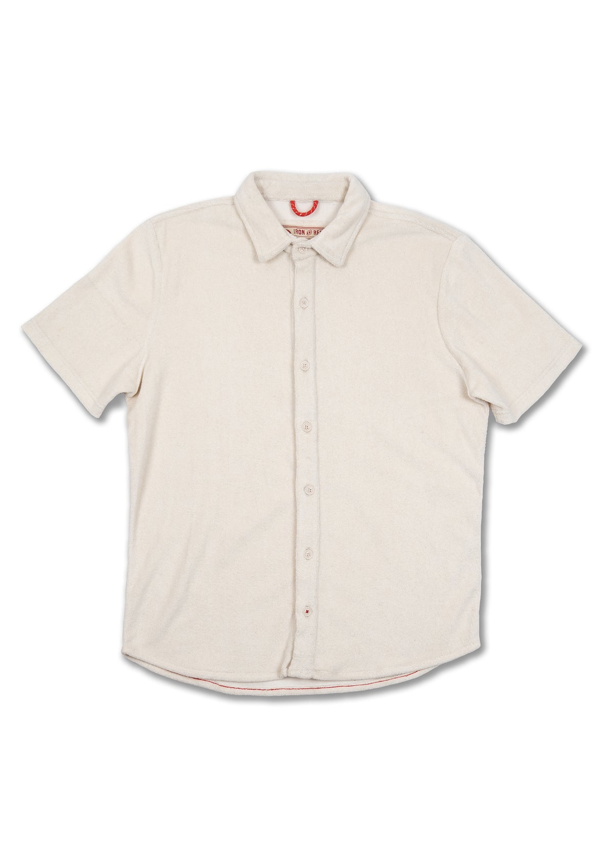 Cream short-sleeve button-up shirt with a collar, displayed flat against a white background, highlighting its simple design.