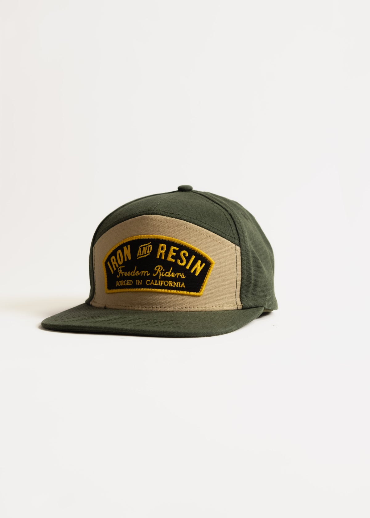 Green and beige cap with "Iron and Resin, Freedom Riders, Forged in California" patch, displayed on a white background.
