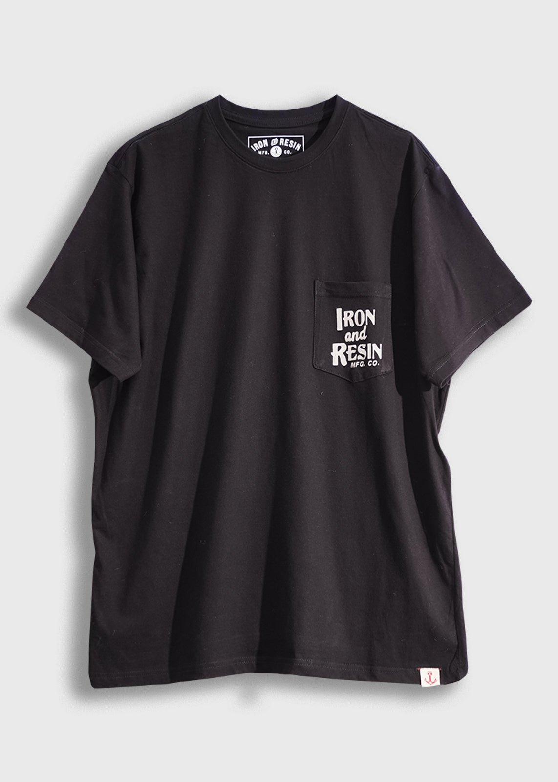 Black T-shirt with "Iron and Resin" logo on chest pocket. Simple design, casual style, perfect for everyday wear.